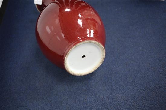A large Chinese sang de boeuf glazed baluster vase, early 20th century, 50.5cm, wood stand, base drilled